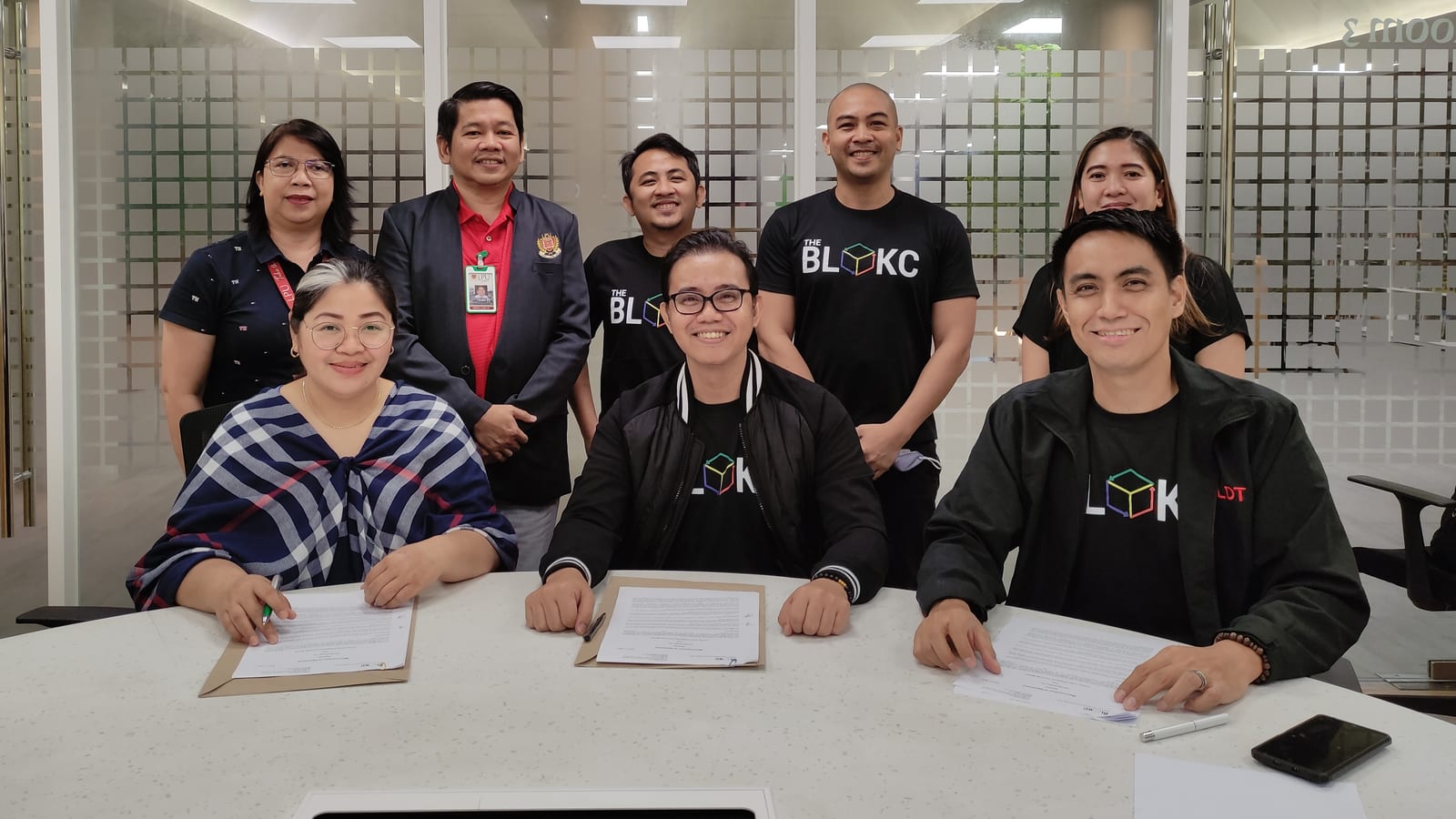 Partners in The BLOKC shirts signing a memorandum of agreement with Lyceum of the Philippines University and PLDT.