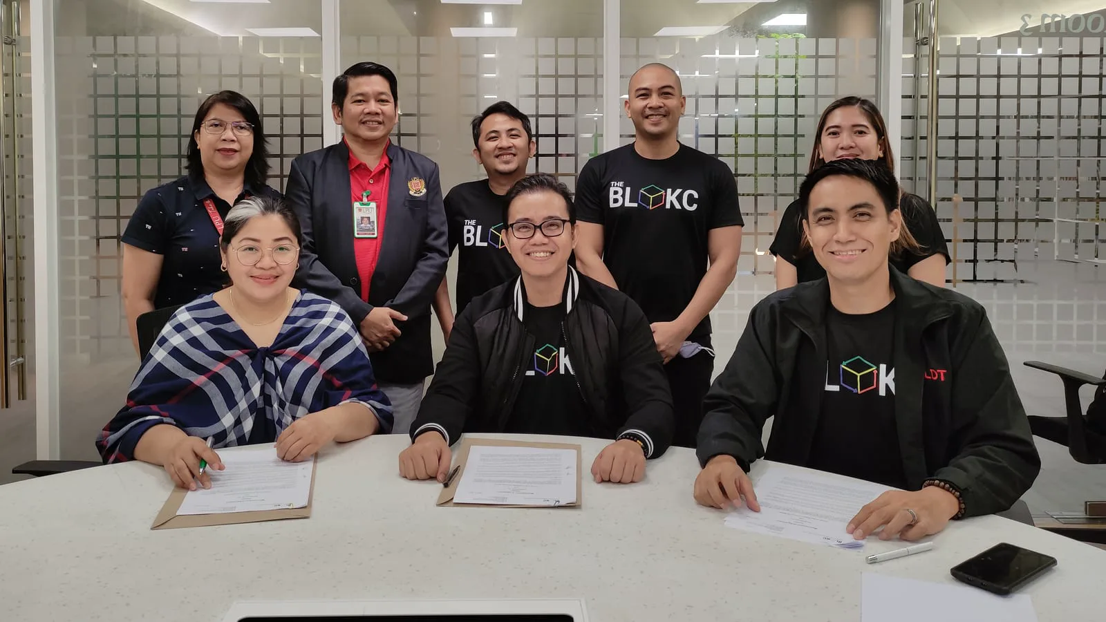 Partners in The BLOKC shirts signing a memorandum of agreement with Lyceum of the Philippines University and PLDT.