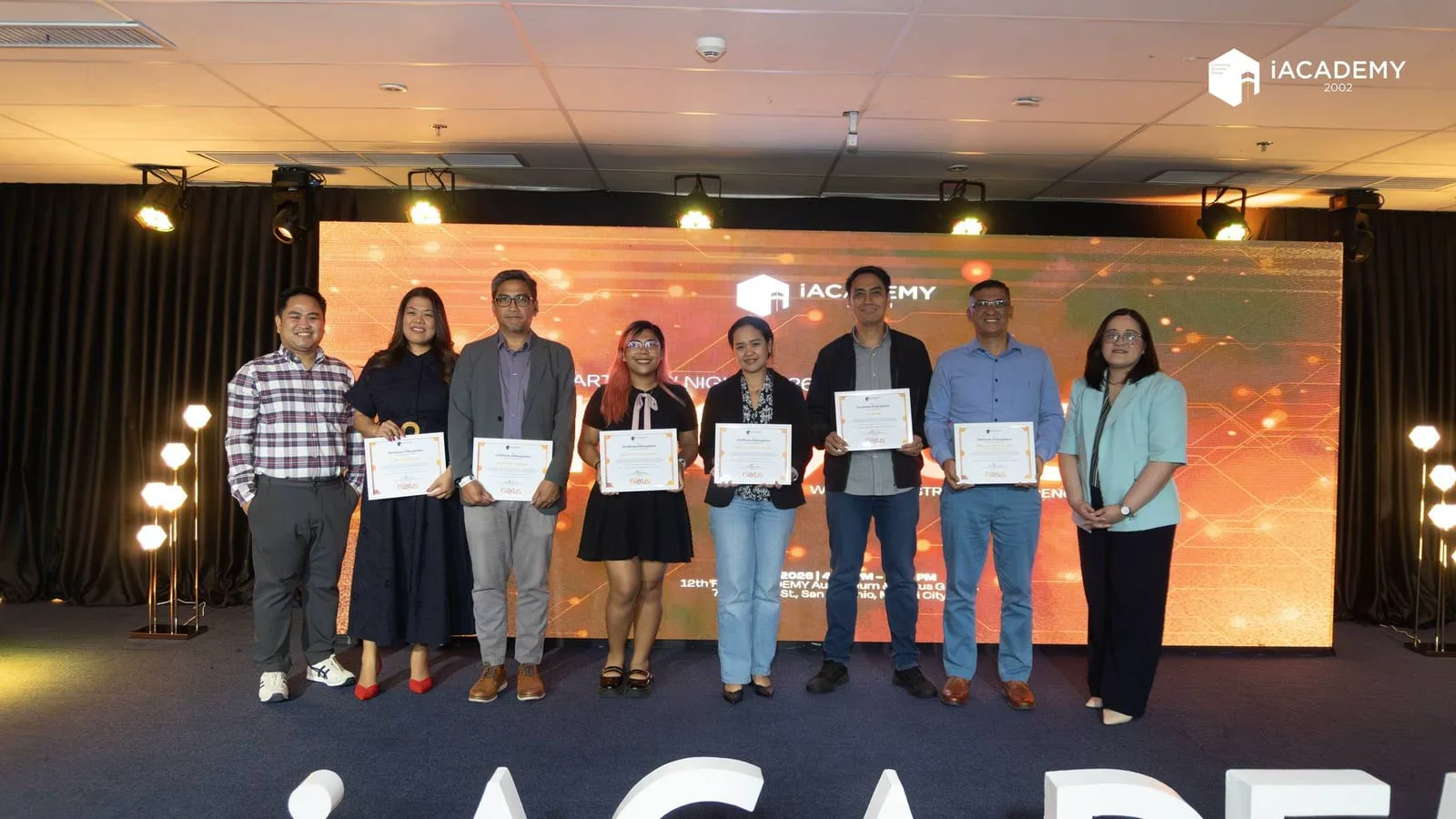 Partners receiving certificates at an iAcademy industry partners recognition event with The BLOKC.