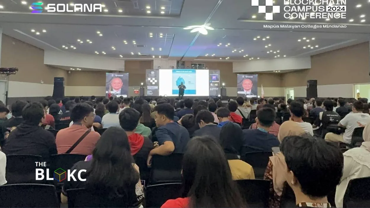 A packed audience watches a stage talk at Blockchain Campus Conference 2024, held at Mapúa Malayan Colleges Mindanao.
