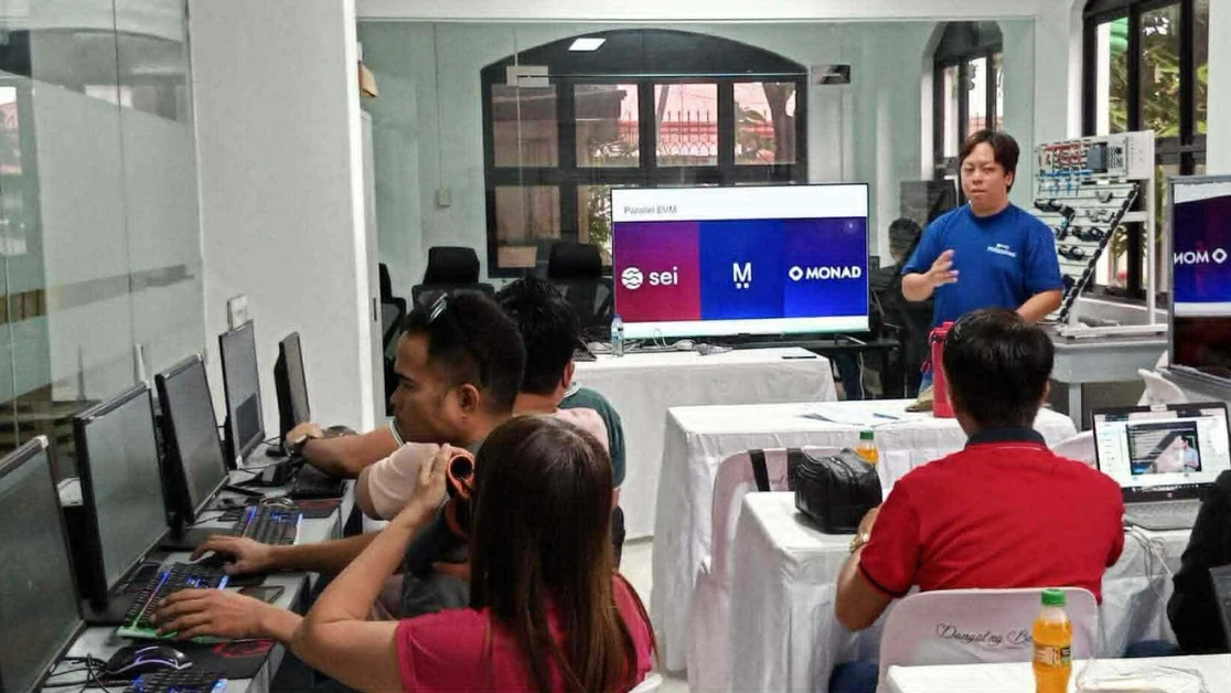 The BLOKC corporate blockchain training in progress with team members engaged in hands-on activities.